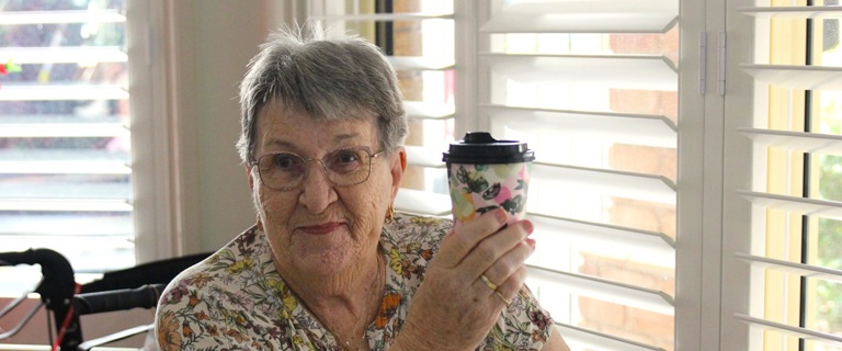 Roma enjoying her coffee.jpg Roma enjoying her coffee.jpg